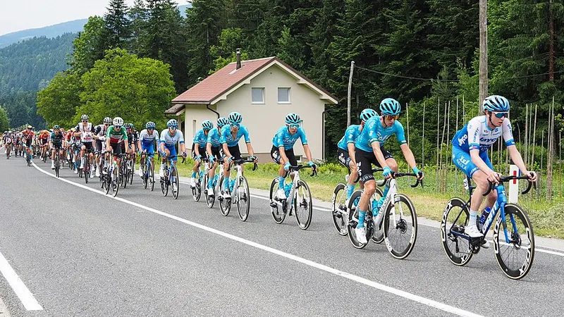 Road cyclists riding together in a race peloton