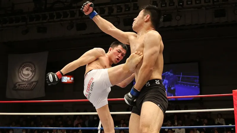 Mixed martial arts competitors exchanging kicks in a ring