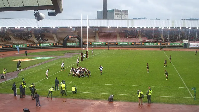 Rugby union teams competing on a stadium pitch